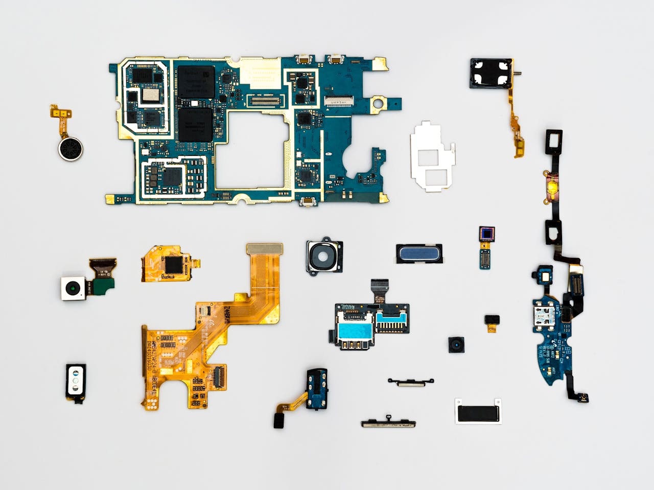Smartphone components laid out for repair