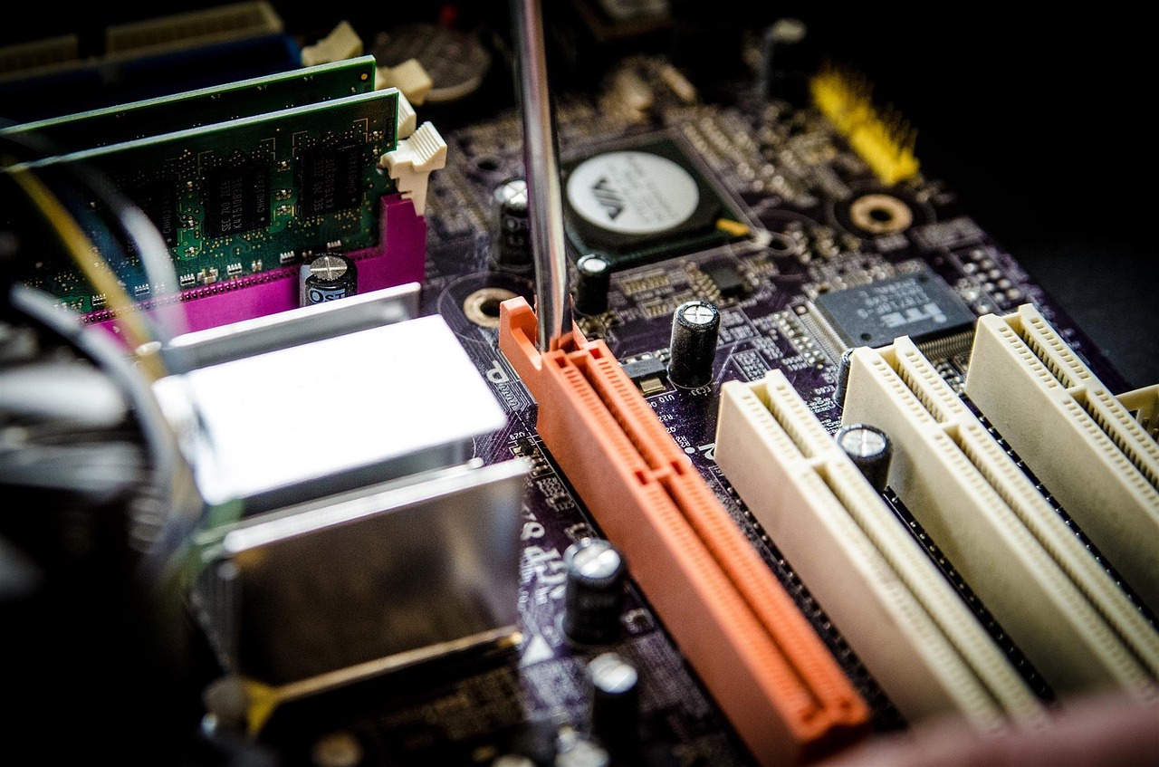 Technician repairing the inside of a computer